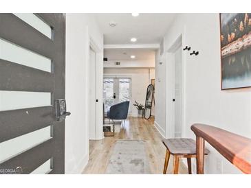 Hallway with stylish front door and contemporary decor leading to living area at 3229 Kingsdale Dr # 2, Atlanta, GA 30311