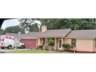Charming single-story home featuring stone accents and a covered front porch at 10359 Briarbay Loop, Jonesboro, GA 30238