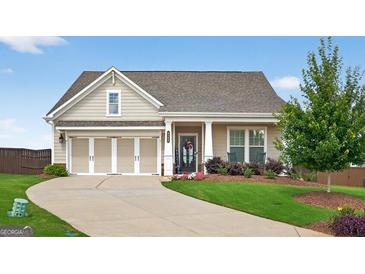 Charming single-story home with manicured lawn, three-car garage, and inviting front porch at 4160 Grandview Vista St, Cumming, GA 30028