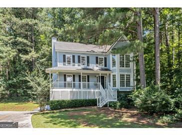 Charming two-story home with a welcoming front porch and lush landscaping at 3 Maplelake Dr, Acworth, GA 30101