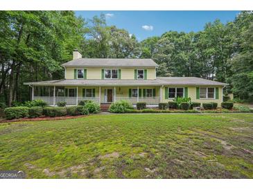 Charming two-story home with inviting front porch and beautifully landscaped front yard at 2110 Waterloo Cir, Lawrenceville, GA 30043