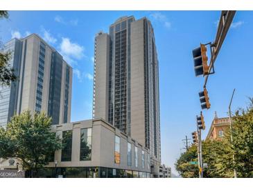 High-rise condominium building with an outdoor view and a cityscape setting against a vibrant blue sky at 1280 W Peachtreestreetsuffix=Street Nw # 808, Atlanta, GA 30309