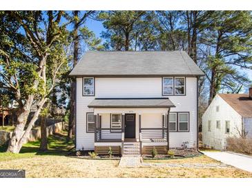 Charming two-story home with a welcoming front porch and well-maintained landscaping at 870 Gaston Sw St, Atlanta, GA 30310
