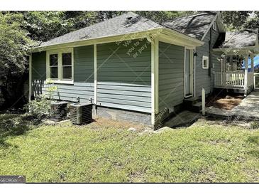 Charming exterior view of the home surrounded by lush greenery at 1914 North Nw Ave, Atlanta, GA 30318