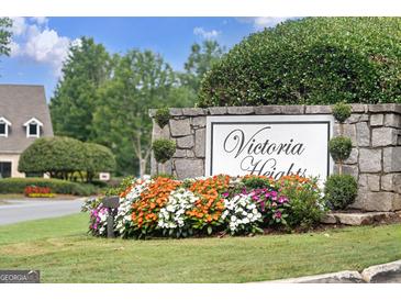 Stone community sign with manicured landscaping, reading 'Victoria Heights' at 5207 Santa Fe Pkwy, Sandy Springs, GA 30350