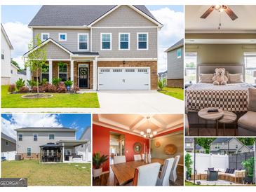 Charming two-story home with a well-manicured lawn and attached two-car garage at 13568 Scenic Pkwy, Covington, GA 30014