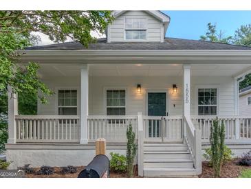 Inviting home with charming front porch and classic architectural details at 1555 New Ne St, Atlanta, GA 30307
