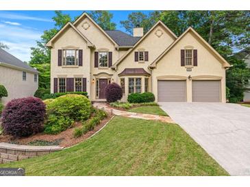 Beautiful two-story home with a well-manicured lawn and a two-car garage at 2864 Wyndcliff Ct, Marietta, GA 30066
