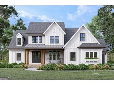 Charming new construction home featuring a farmhouse design with a welcoming front porch and manicured lawn at 651 Burg Rd, Locust Grove, GA 30248
