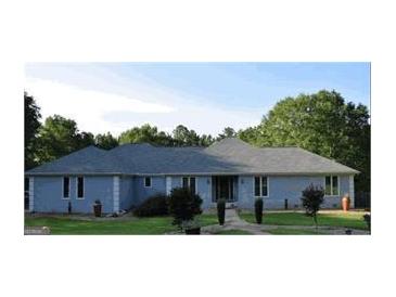 Inviting single story home with a charming walkway and beautiful front yard landscaping at 1455 River Cove Rd, Social Circle, GA 30025