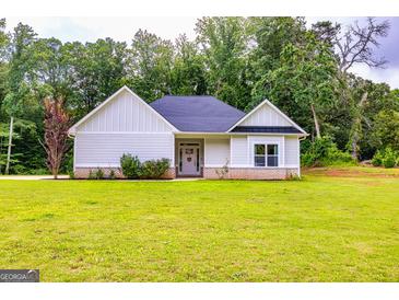 Charming single-story home with a well-manicured lawn and inviting entryway at 40 Westbrook Rd, Carrollton, GA 30116