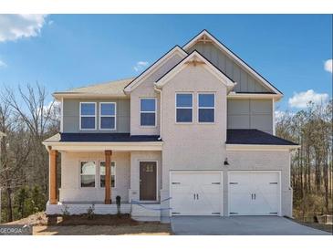 Charming two-story home with a welcoming front porch and a two-car garage, offering curb appeal at 257 Orwell Drive Lot 48 # 48, Social Circle, GA 30025