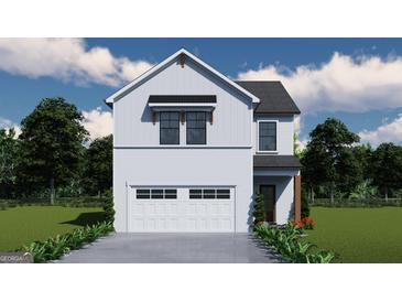 Charming two-story home with a white brick and siding exterior, and an attached two-car garage at 4434 Eastbrook Pl # 59A, Snellville, GA 30039
