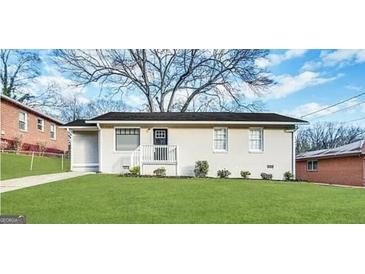 Charming one-story home with a well-maintained lawn and classic exterior at 70 Macon Se Pl, Atlanta, GA 30354