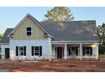 Charming new construction features a two-story design with a welcoming porch and classic black shutters at 78 Maddox Road, Mcdonough, GA 30252