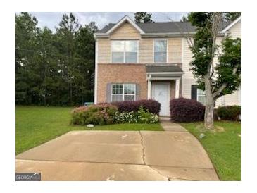 Charming two-story home with front lawn and driveway at 737 Outlook Way, Atlanta, GA 30349