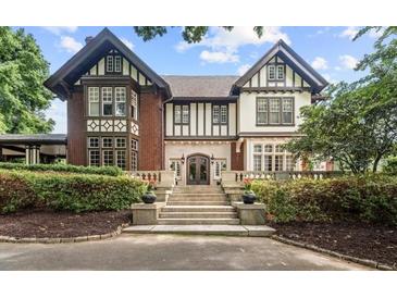 Beautiful home featuring an English Tudor architectural style and mature landscaping at 1585 S Ponce De Leon Ave # M4, Atlanta, GA 30307