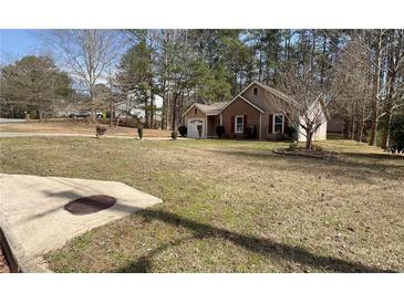 Charming single Gathering home with brick and siding exterior on a spacious lot at 5947 Rock Rd, Union City, GA 30291