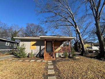 Newly renovated house with a front porch and stone pathway at 781 Peyton Nw Ave, Atlanta, GA 30318