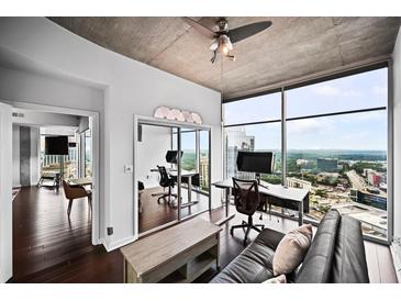 Bright office space with expansive windows and city views, perfect for working from home at 3324 Peachtree Ne Rd # 2718, Atlanta, GA 30326