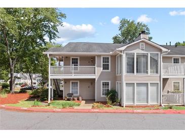 Inviting two-story condo with well-maintained landscaping and covered porch at 707 Augusta Se Dr, Marietta, GA 30067