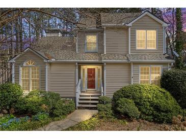 Charming home featuring a traditional design, well-maintained landscaping, and inviting front entrance at 978 W Mill Bnd, Kennesaw, GA 30152