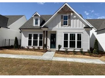 Charming single-Gathering home featuring a beautifully landscaped front yard and a welcoming facade at 507 Godfrey Dr, Cumming, GA 30040