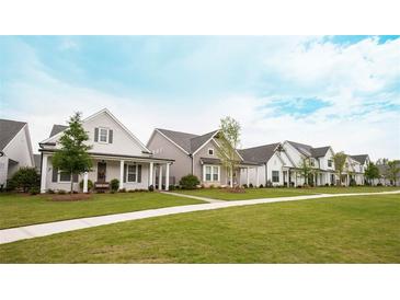 New homes community showcasing charming craftsman style houses with lush lawns at 503 Godfrey Dr, Cumming, GA 30040