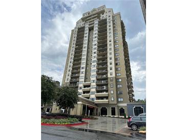 Contemporary high-rise condo building with private balconies and manicured landscaping at 795 Hammond Dr # 2007, Atlanta, GA 30328