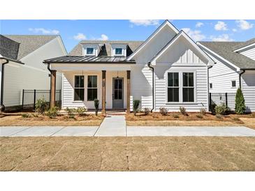 Charming new construction home featuring a manicured lawn and craftsman-style details at 505 Godfrey Dr, Cumming, GA 30040
