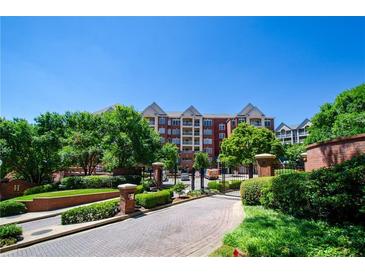 Gated community with mature trees and well-maintained landscaping provides an inviting entrance at 211 Colonial Homes Dr # 2304, Atlanta, GA 30309