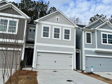Charming new construction townhome with a two-car garage and a beautifully designed exterior at 5150 Longview Run, Decatur, GA 30035