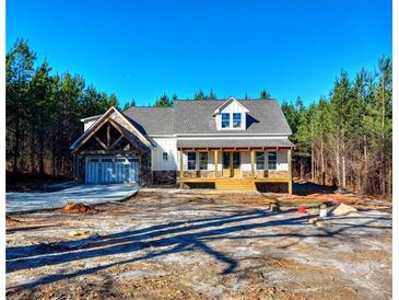 Craftsman style home with stone accents and a two-car garage at 136 Rainey Rd, Temple, GA 30179