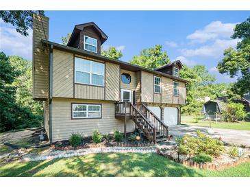 Two-story house with a double garage and landscaped front yard at 2641 Short Trl, Lithia Springs, GA 30122