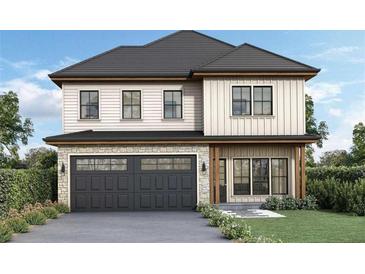 Charming two-story home boasts a gray roof, stone accents, a gray garage door, and a well-manicured lawn at 2884 Thompson Cir, Decatur, GA 30034