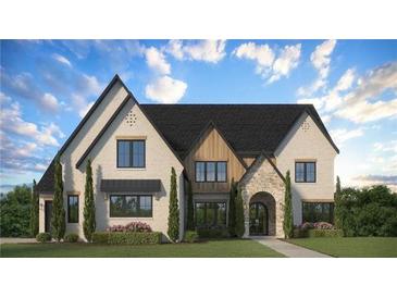Inviting two-story home with a brick facade, detailed trim, and a lush green lawn at 2013 Old Atlanta Rd, Cumming, GA 30041