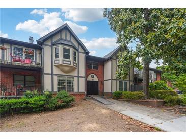 Inviting condo showcasing a blend of Tudor and modern architecture with a charming garden setting and private balcony at 6851 Roswell Rd # E1, Atlanta, GA 30328