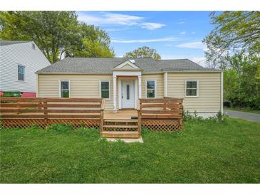 Charming single-story home with a wooden deck and well-maintained front yard at 1159 Fair Sw St, Atlanta, GA 30314