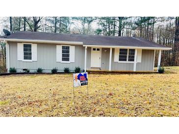 Newly painted house with a yard, ready for new owners at 130 Taunton Rd, Covington, GA 30014