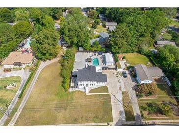 Expansive aerial view of a charming two-story home with a pool and a large lot at 3636 Evans Rd, Atlanta, GA 30340