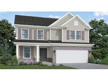 Charming two-story home featuring stone accents, a two-car garage, and a well-manicured lawn at 6004 Spring Way, Stonecrest, GA 30038