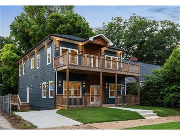 Stunning two-story home featuring double wooden balconies and eye-catching curb appeal at 971 Washington Sw Pl, Atlanta, GA 30314