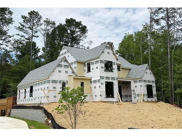 New construction home featuring modern design elements and a spacious layout in a private, wooded setting at 440 Allyson Cir, Alpharetta, GA 30009