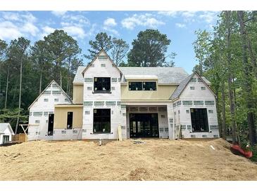 New home construction features a modern design, large windows, and durable house wrap at 440 Allyson Cir, Alpharetta, GA 30009