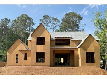 Unfinished two-story home featuring a gable roof, framed windows, and wood sheathing at 440 Allyson Cir, Alpharetta, GA 30009