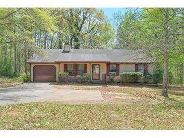 Charming single-story home with a well-maintained front yard and a cozy, inviting atmosphere at 798 Tommy Lee Cook Rd, Palmetto, GA 30268