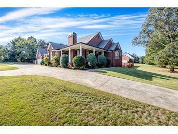 Brick house with large yard and driveway at 1231 Bent Creek Dr, Mcdonough, GA 30252