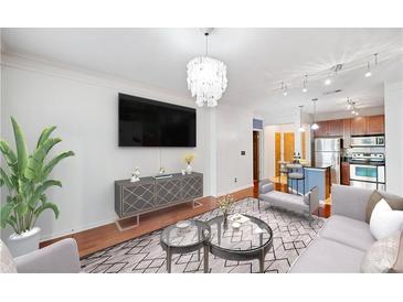 Bright living space with hardwood floors, modern lighting, and an open floor plan at 400 17Th Nw St # 2120, Atlanta, GA 30363