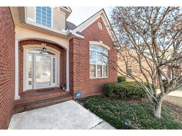Brick home with a welcoming front porch and landscaped yard at 1979 Spivey Village Dr, Jonesboro, GA 30236