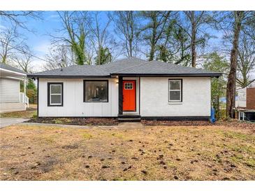 Charming renovated home with a bright orange door at 641 Hamilton E Holmes Nw Dr, Atlanta, GA 30318